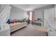 This bedroom features a neutral wall, window, and ample natural light at 11712 Winterset Cove Dr, Riverview, FL 33579