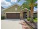 Charming single-Gathering home featuring a stone-accented entryway and well-maintained landscaping at 11712 Winterset Cove Dr, Riverview, FL 33579