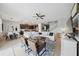 Open living space featuring a dining area and a view into the modern kitchen at 11712 Winterset Cove Dr, Riverview, FL 33579
