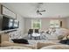 Bright living room with a comfortable sofa, modern decor, and serene pond view at 11712 Winterset Cove Dr, Riverview, FL 33579