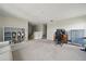 Open loft featuring neutral walls, plush carpet, built-in shelving, and flexible living space at 11712 Winterset Cove Dr, Riverview, FL 33579
