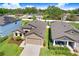 An aerial view of a cozy home showcasing its well-maintained roof and adjacent properties at 1214 Florablu Dr, Seffner, FL 33584