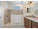 Modern bathroom with a glass-enclosed shower, granite countertop, and tile flooring at 1214 Florablu Dr, Seffner, FL 33584