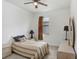 Cozy bedroom with neutral tones, comfortable bed and a ceiling fan at 1214 Florablu Dr, Seffner, FL 33584