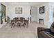 Bright dining room showcases tile floors and views of the living space at 1214 Florablu Dr, Seffner, FL 33584