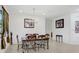 Spacious dining area features elegant lighting fixtures and neutral wall colors at 1214 Florablu Dr, Seffner, FL 33584