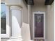 Stylish front door with decorative wreath, elegant column, and a welcoming entrance at 1214 Florablu Dr, Seffner, FL 33584
