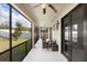 Covered lanai with ceiling fans, outdoor furniture, and screens overlooking the backyard at 1214 Florablu Dr, Seffner, FL 33584