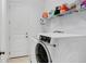 Clean and functional laundry room with modern washer and dryer at 1214 Florablu Dr, Seffner, FL 33584