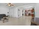 Open-concept living area seamlessly connects to the kitchen with stylish flooring at 1214 Florablu Dr, Seffner, FL 33584