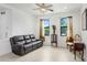 Cozy living room filled with natural light and a comfortable sofa at 1214 Florablu Dr, Seffner, FL 33584