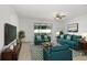 Bright living room features modern furnishings, sleek lighting, and sliding glass door at 1214 Florablu Dr, Seffner, FL 33584