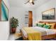 Comfortable primary bedroom with en-suite bathroom boasts stylish furniture and decor elements at 1214 Florablu Dr, Seffner, FL 33584