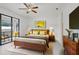 Comfortable primary bedroom with modern furniture, en-suite bathroom, and stylish décor elements at 1214 Florablu Dr, Seffner, FL 33584