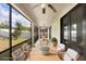 Inviting screened patio with ceiling fan and stylish seating area perfect for relaxation and outdoor dining at 1214 Florablu Dr, Seffner, FL 33584
