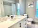 Modern bathroom with granite countertops, sleek fixtures, and a shower/tub combo at 12432 81St Ct, Seminole, FL 33772