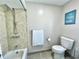 Bathroom featuring a shower and tub combo and a toilet at 12432 81St Ct, Seminole, FL 33772