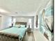 Spacious bedroom with wood floors, stylish decor and ample natural light at 12432 81St Ct, Seminole, FL 33772
