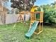 ' playground with a slide, swing, and climbing area, designed for outdoor fun and activity at 12432 81St Ct, Seminole, FL 33772