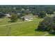 Aerial view of a property with a single-story house, a long driveway, and lush greenery all around at 1292 Myers Rd, Brooksville, FL 34602