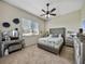 Cozy bedroom featuring plush carpet, a ceiling fan, a window and decorative silver furniture at 1292 Myers Rd, Brooksville, FL 34602