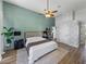 Stylish bedroom featuring hardwood floors, accent wall, and natural light at 1292 Myers Rd, Brooksville, FL 34602