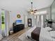 Bright bedroom with wood floors, modern decor, and sliding glass doors to the outdoor space at 1292 Myers Rd, Brooksville, FL 34602