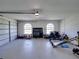 Spacious garage with ample storage, natural light, and a variety of tools and equipment at 1292 Myers Rd, Brooksville, FL 34602