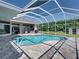 Swimming pool and screened enclosure surrounded by brick patio with views of the house and yard at 1292 Myers Rd, Brooksville, FL 34602