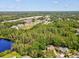 Aerial view of a home nestled among trees, offering a sense of privacy and seclusion at 13806 Sumac Pl, Tampa, FL 33625