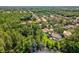 Majestic aerial view of property nestled amidst lush greenery and a shimmering body of water at 13806 Sumac Pl, Tampa, FL 33625