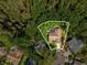 Aerial view of home with pool, bordered by lush green trees offering unparalleled privacy at 13806 Sumac Pl, Tampa, FL 33625