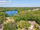 Stunning aerial view of lakeside home with sparkling lake views at 13806 Sumac Pl, Tampa, FL 33625