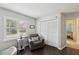 Bedroom with hardwood floors and a cozy reading nook at 13806 Sumac Pl, Tampa, FL 33625