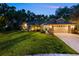 Charming home with manicured lawn, updated fixtures, and a spacious two-car garage at 13806 Sumac Pl, Tampa, FL 33625