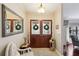 Inviting foyer with elegant decor, a decorative mirror, and a glimpse into the home's interior at 13806 Sumac Pl, Tampa, FL 33625