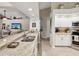 Kitchen featuring a large, beautiful granite countertop and ample storage space at 13806 Sumac Pl, Tampa, FL 33625