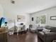Home office with a desk, computer, lamp, chair, and a hardwood floor at 13806 Sumac Pl, Tampa, FL 33625