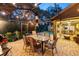 A patio with a glass table, wicker chairs, and an umbrella at 13806 Sumac Pl, Tampa, FL 33625