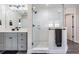 Bathroom features a glass enclosed shower, gray vanity, and black fixtures at 14507 Woodland Spur Dr, Lithia, FL 33547