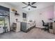 Charming bedroom featuring a ceiling fan, natural light, and neutral decor, creating a cozy and inviting atmosphere at 14507 Woodland Spur Dr, Lithia, FL 33547
