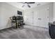 Bedroom with desk, ceiling fan, and large closet doors at 14507 Woodland Spur Dr, Lithia, FL 33547