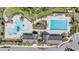 Aerial view of the community pool and clubhouse featuring a variety of seating and swimming options at 14507 Woodland Spur Dr, Lithia, FL 33547