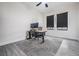 Office space features a desk, office chair and large area rug at 14507 Woodland Spur Dr, Lithia, FL 33547