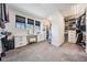 Spacious walk-in closet featuring shelving, drawers, and a vanity at 14507 Woodland Spur Dr, Lithia, FL 33547