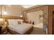 Relaxing bedroom with a king-size bed, ambient lighting, and a view into a separate seating area at 15000 Madeira Way # 510, Madeira Beach, FL 33708