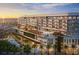Stunning beachfront hotel with multiple pools, palm trees, and ocean views at sunset at 15000 Madeira Way # 640, Madeira Beach, FL 33708