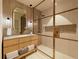 Modern bathroom boasts a glass-enclosed shower, sleek vanity, and contemporary fixtures for a spa-like retreat at 15000 Madeira Way # 641, Madeira Beach, FL 33708
