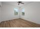 Bedroom featuring bright windows, and sleek wood-look floors at 16030 Bella Woods Dr, Tampa, FL 33647