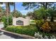 Stone Seascape community entrance sign surrounded by vibrant, manicured landscaping at 1686 Seascape Cir, Tarpon Springs, FL 34689